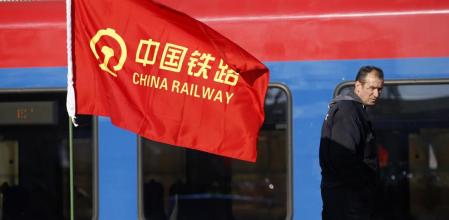 A worker walks on the site of the reconstruction of a railway line between Budapest and Belgrade, in Belgrade, Serbia, Tuesday, Nov. 28, 2017. Reconstruction of a railway line between Budapest and Belgrade, a project financed mainly by China, as a 